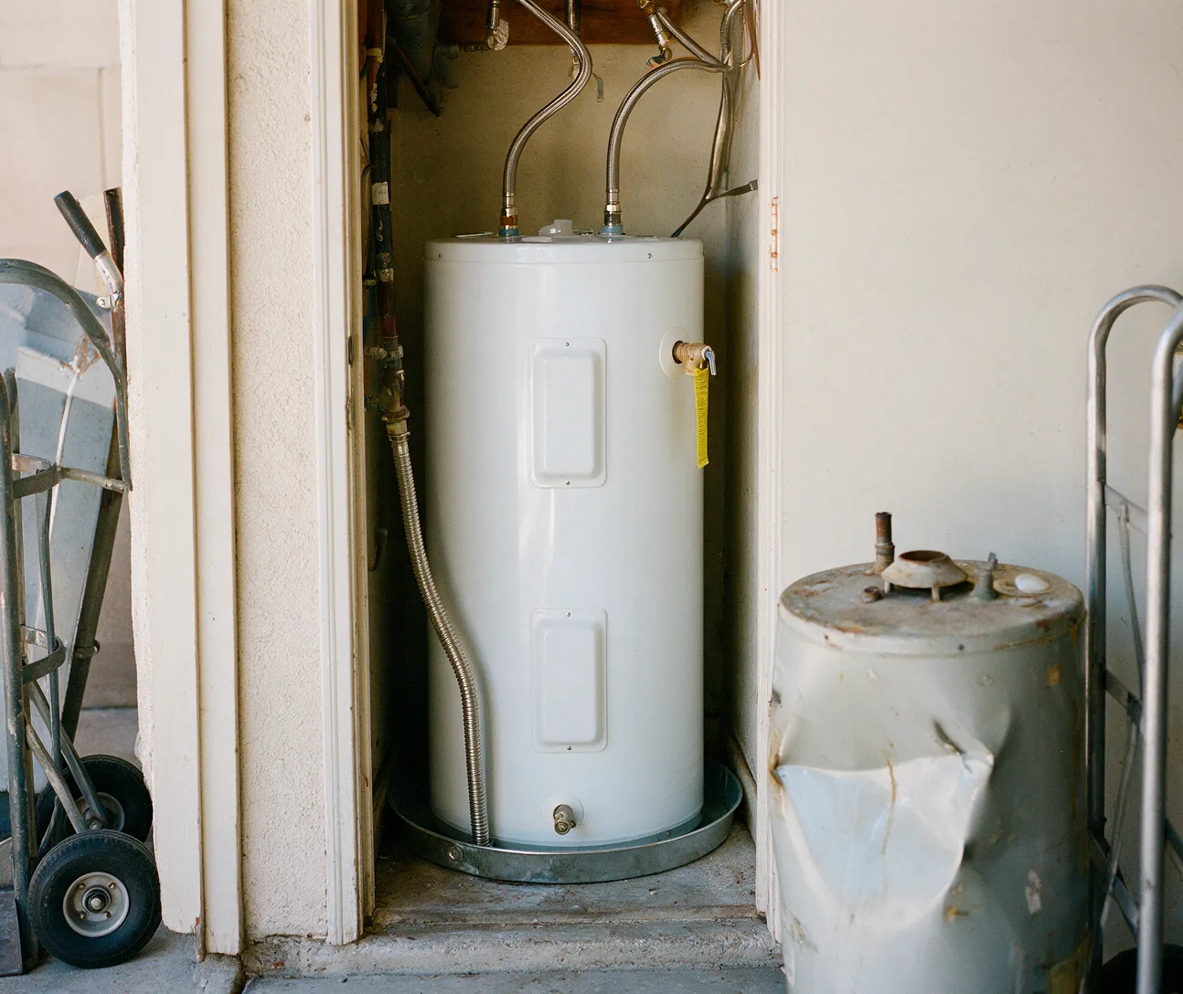 A new electric water heater fitted in a utility closet